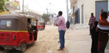 Youth activist Ahmed Aden Hashi spreads information on COVID-19 in Mogadishu by utilizing a megaphone