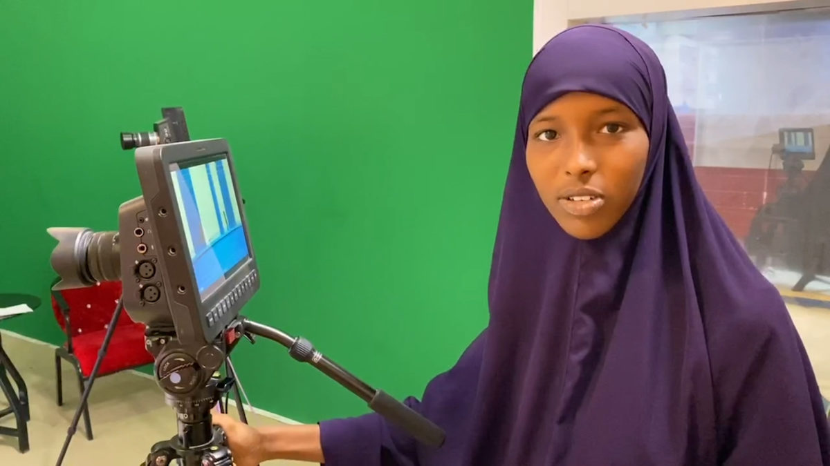 Somali National TV camerawoman Nastexo Abdi Jaliil at work. SNTV has supported the dissemination of the produced videos and studio discussion on COVID-19.